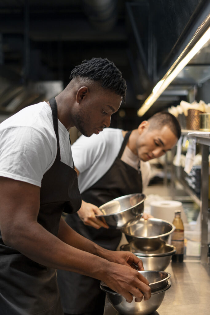 chef cooking kitchen while wearing professional attire chef cooking kitchen while wearing professional attire
