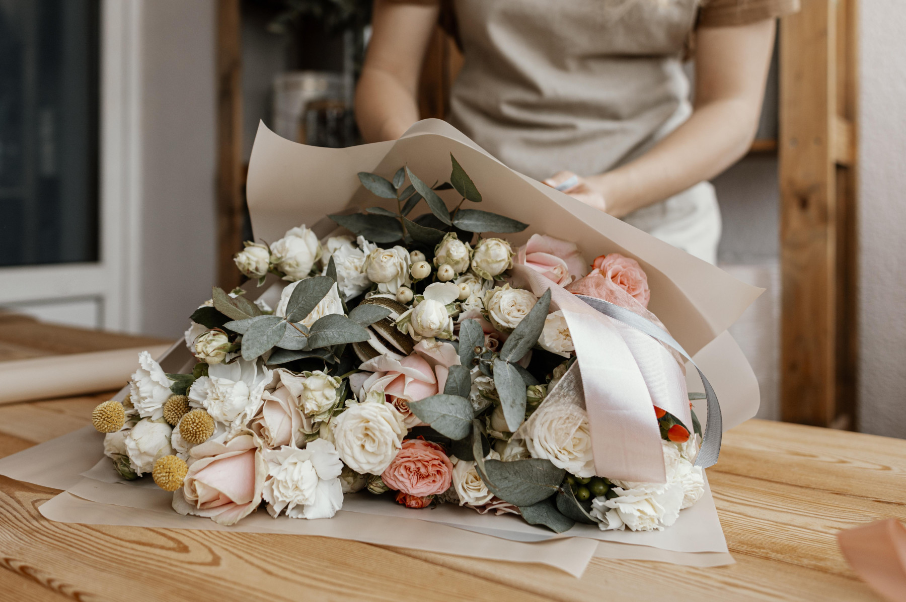woman making pretty floral arrangement